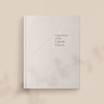 photo of Catechism of the Catholic Church cover on light brown background