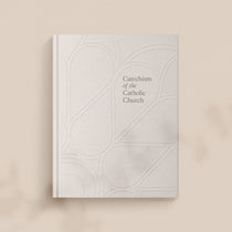 photo of Catechism of the Catholic Church cover on light brown background 